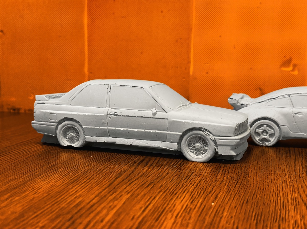 Side profile of the grey concrete '80s saloon